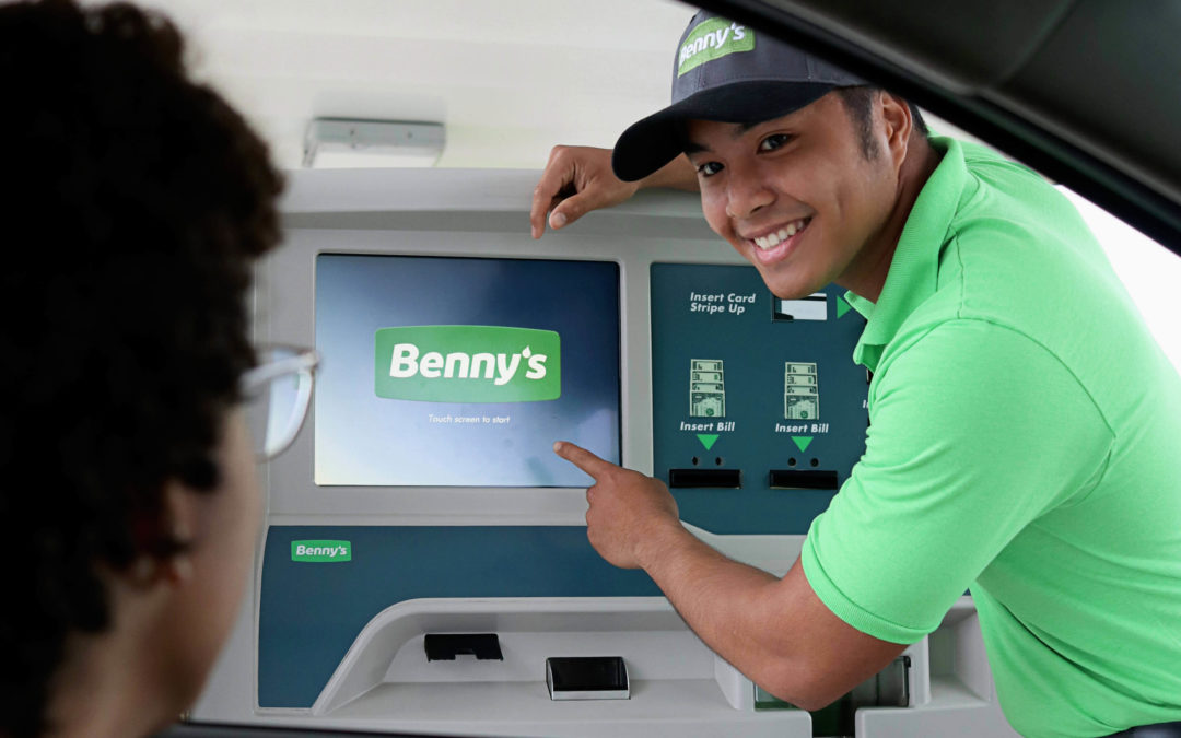 Benny's pay station with employee pointing to screen